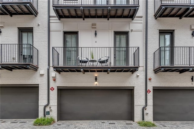 574 Boulevard Pl NE Unit 4, Atlanta, GA 30308 - view of building exterior featuring a garage and driveway