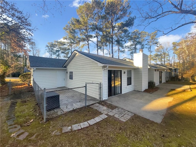 view of side of home featuring a patio