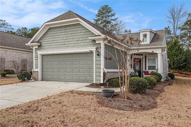 view of front of house featuring covered porch and a garage