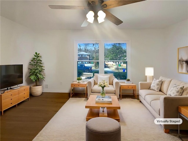 living room with ceiling fan and wood-type flooring