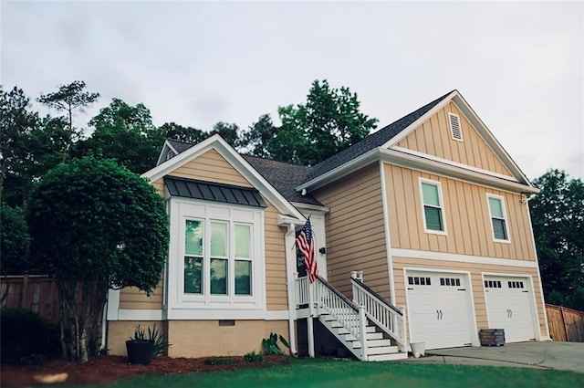 2193 Kildare Way NW, Kennesaw, GA 30152 - view of front of home featuring board and batten siding, a garage, driveway, a standing seam roof, and roof with shingles