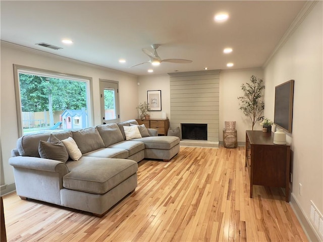 2193 Kildare Way NW, Kennesaw, GA 30152 - living room featuring ornamental molding, light wood-style flooring, recessed lighting, a fireplace, and a ceiling fan