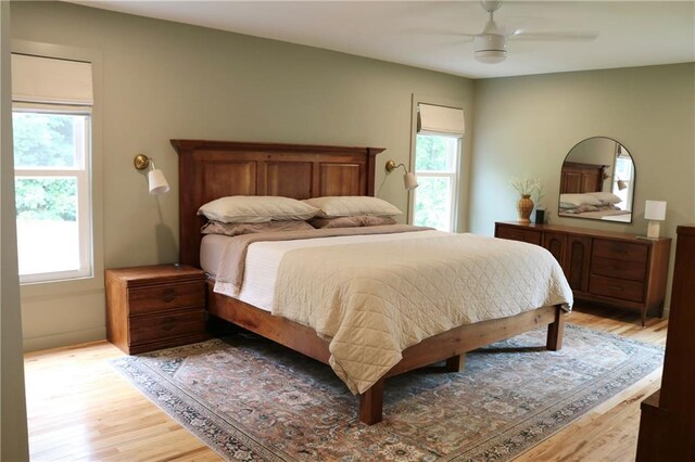 2193 Kildare Way NW, Kennesaw, GA 30152 - bedroom featuring multiple windows, light wood finished floors, and a ceiling fan