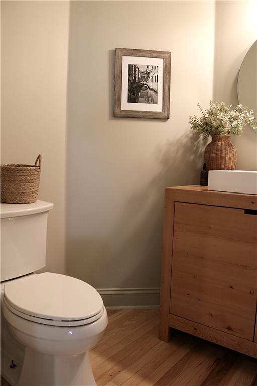 2193 Kildare Way NW, Kennesaw, GA 30152 - bathroom featuring wood finished floors, toilet, and baseboards