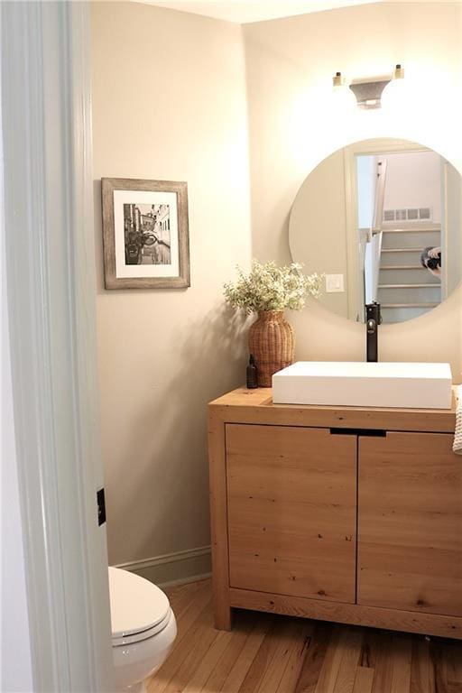 2193 Kildare Way NW, Kennesaw, GA 30152 - bathroom featuring vanity, wood finished floors, toilet, and baseboards