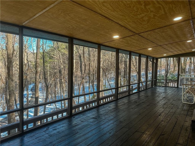unfurnished sunroom featuring a healthy amount of sunlight