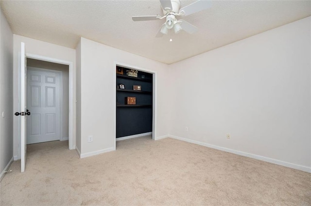 409 Cold Springs Ln, Mcdonough, GA 30252 - unfurnished bedroom with light carpet, baseboards, a textured ceiling, and ceiling fan