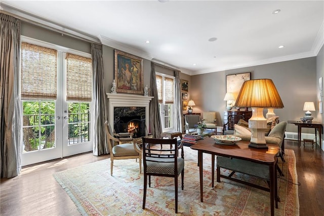 122 Old Ivy Rd NE Unit 17, Atlanta, GA 30342 - living room featuring crown molding, wood finished floors, recessed lighting, a premium fireplace, and french doors