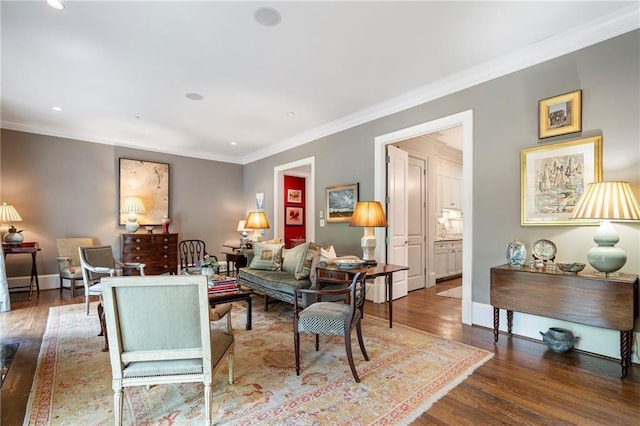 122 Old Ivy Rd NE Unit 17, Atlanta, GA 30342 - living room featuring wood finished floors, crown molding, recessed lighting, and baseboards