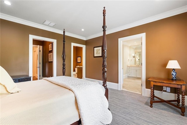 122 Old Ivy Rd NE Unit 17, Atlanta, GA 30342 - bedroom featuring connected bathroom, ornamental molding, light colored carpet, recessed lighting, and baseboards