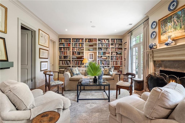 122 Old Ivy Rd NE Unit 17, Atlanta, GA 30342 - living area with built in shelves, crown molding, recessed lighting, a premium fireplace, and baseboards
