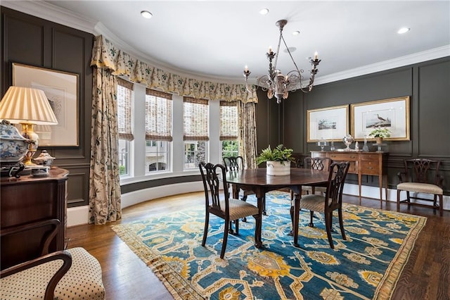122 Old Ivy Rd NE Unit 17, Atlanta, GA 30342 - dining room featuring a chandelier, crown molding, wood finished floors, recessed lighting, and a decorative wall