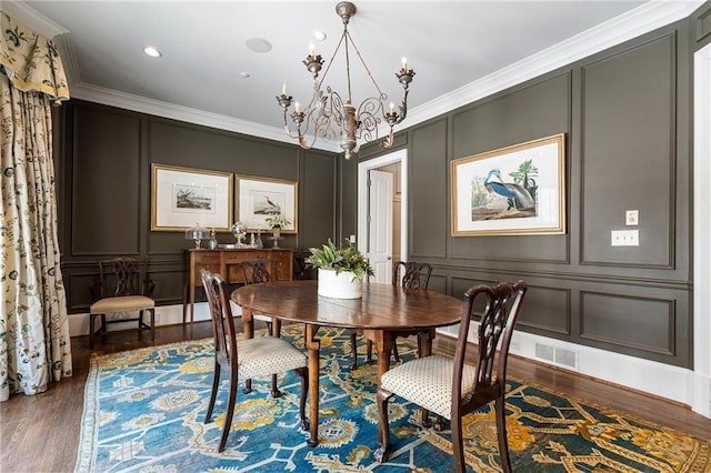 122 Old Ivy Rd NE Unit 17, Atlanta, GA 30342 - dining space with a decorative wall, wood finished floors, a chandelier, ornamental molding, and recessed lighting