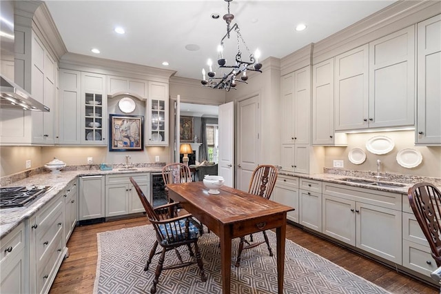 122 Old Ivy Rd NE Unit 17, Atlanta, GA 30342 - dining room with dark wood finished floors, a chandelier, recessed lighting, beverage cooler, and ornamental molding
