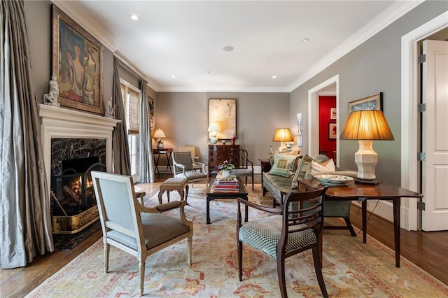 122 Old Ivy Rd NE Unit 17, Atlanta, GA 30342 - living area with wood finished floors, crown molding, recessed lighting, a fireplace, and baseboards