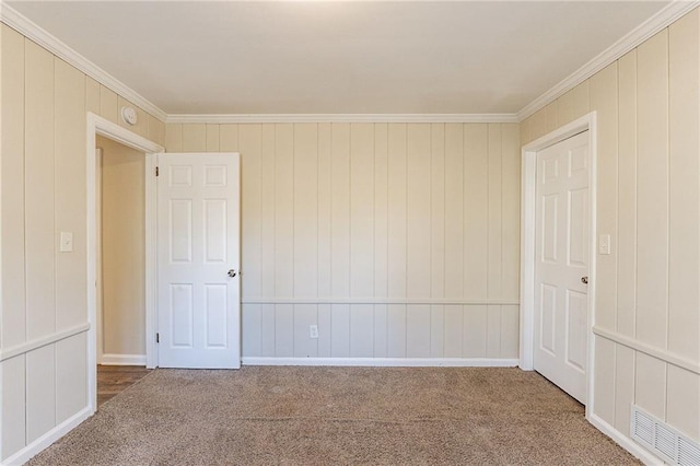 carpeted spare room with ornamental molding