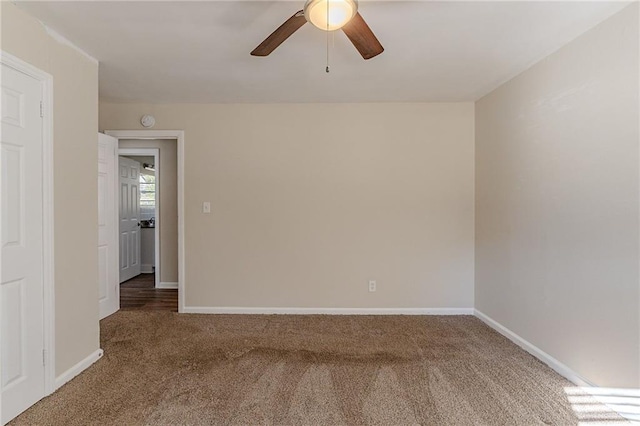 carpeted empty room with ceiling fan