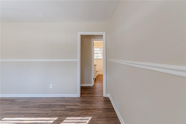 unfurnished room featuring dark hardwood / wood-style floors