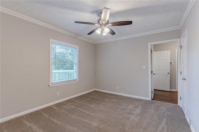 unfurnished room with a textured ceiling, ceiling fan, carpet floors, and ornamental molding