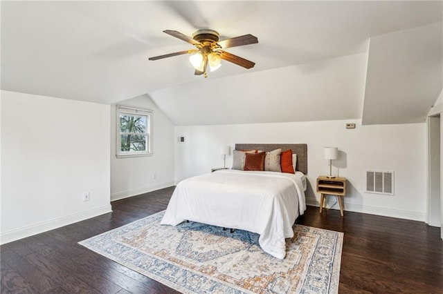 bedroom with dark wood-type flooring, ceiling fan, and lofted ceiling