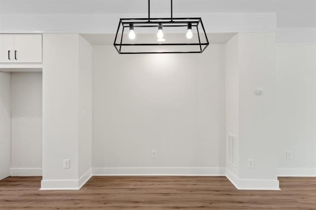 unfurnished dining area with hardwood / wood-style flooring