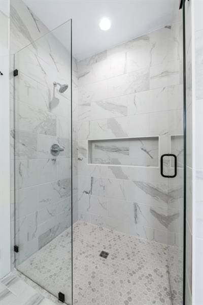 bathroom with an enclosed shower