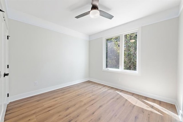 spare room with light hardwood / wood-style floors and ceiling fan