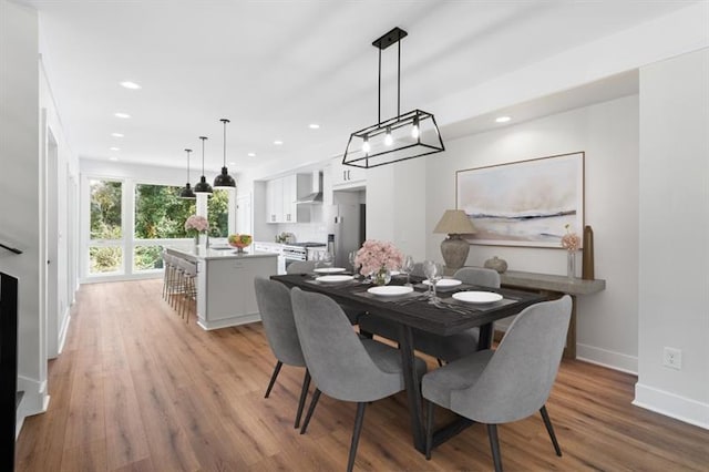 dining area with light hardwood / wood-style floors