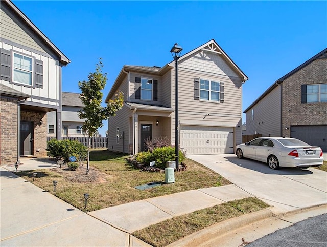2291 Elise Way, Hampton, GA 30228 - view of front of home featuring driveway, a garage, and a front lawn