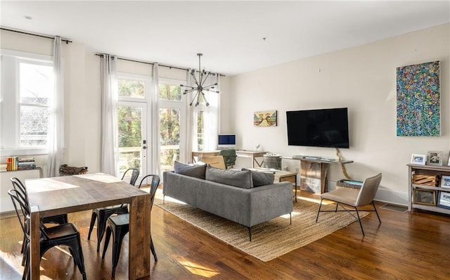 9129 Selborne Ln, Chattahoochee Hills, GA 30268 - living room featuring dark hardwood / wood-style flooring and a chandelier