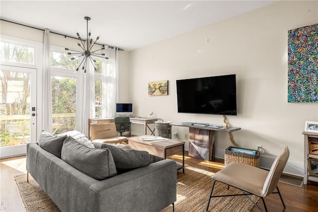 9129 Selborne Ln, Chattahoochee Hills, GA 30268 - living room featuring hardwood / wood-style floors and a notable chandelier