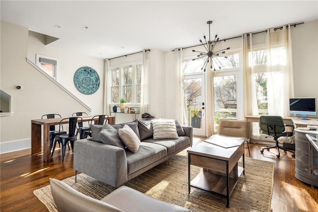 9129 Selborne Ln, Chattahoochee Hills, GA 30268 - living room featuring dark hardwood / wood-style flooring, plenty of natural light, and an inviting chandelier