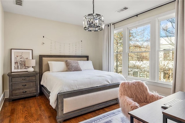 9129 Selborne Ln, Chattahoochee Hills, GA 30268 - bedroom featuring a chandelier and dark wood-type flooring