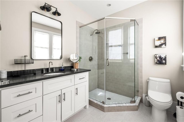 9129 Selborne Ln, Chattahoochee Hills, GA 30268 - bathroom featuring tile patterned floors, vanity, toilet, and a shower with shower door