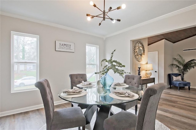 783 Lost Creek Cir, Stone Mountain, GA 30088 - dining room with a chandelier, wood finished floors, crown molding, and baseboards
