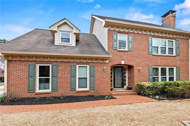 view of front of property featuring brick siding