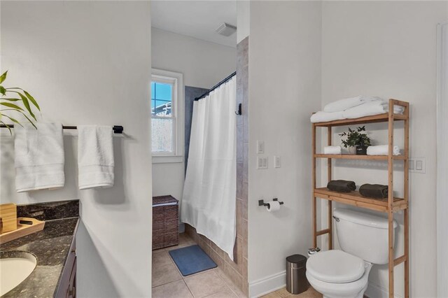 full bath with toilet, a shower with shower curtain, visible vents, vanity, and tile patterned floors