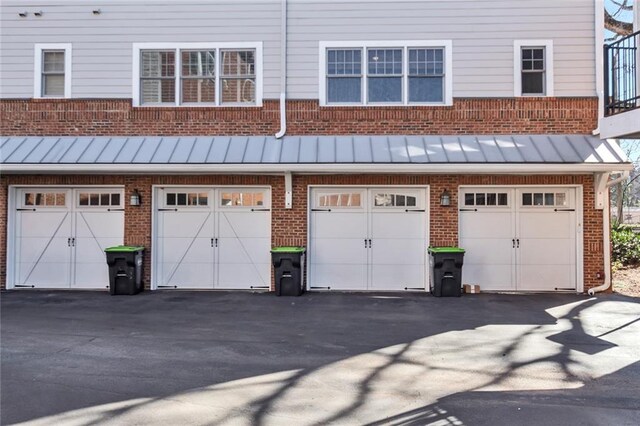 garage featuring aphalt driveway