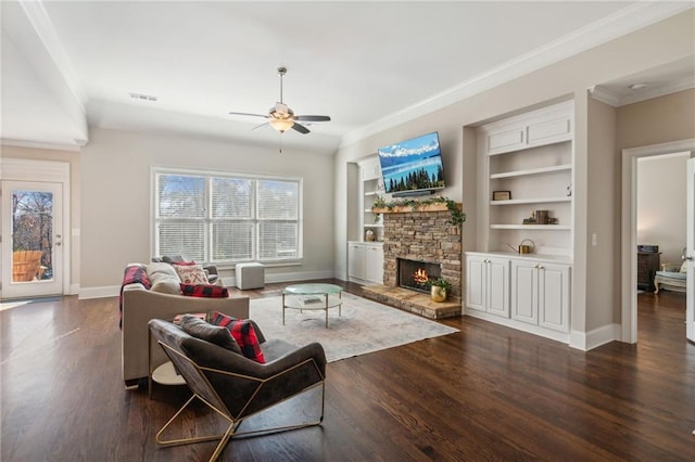 living room featuring dark wood-style floors, a fireplace, and baseboards