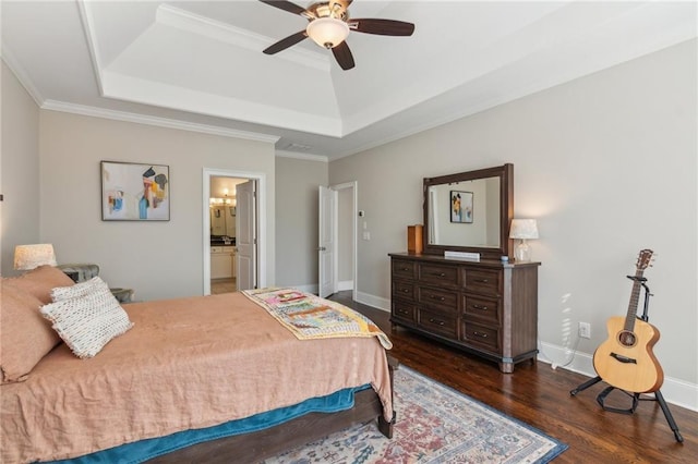 bedroom featuring ornamental molding, dark wood-style flooring, a raised ceiling, and baseboards