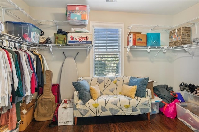 walk in closet with visible vents and wood finished floors