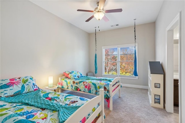 bedroom with a ceiling fan, baseboards, visible vents, and carpet flooring