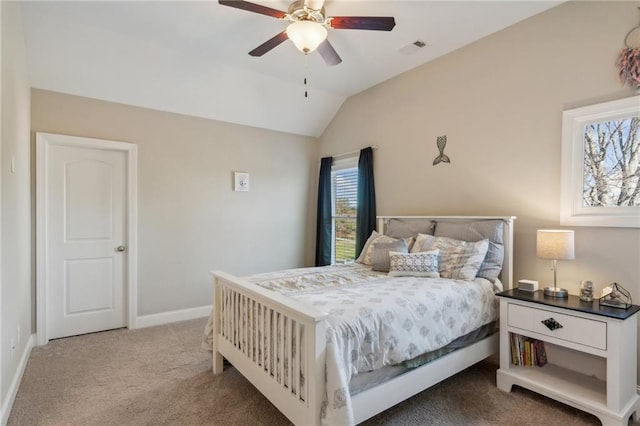 carpeted bedroom with a ceiling fan, visible vents, vaulted ceiling, and baseboards