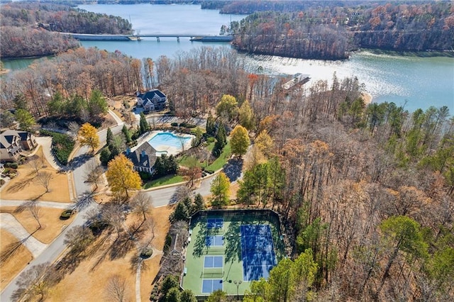 bird's eye view featuring a forest view and a water view