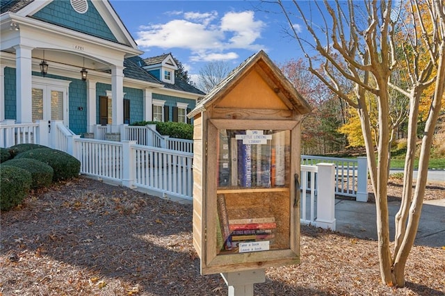 view of outdoor structure with covered porch