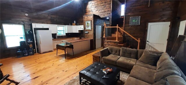 1251 Bar T Ranch Rd, Talking Rock, GA 30175 - living room featuring wood walls, sink, and light hardwood / wood-style floors