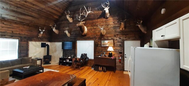 1251 Bar T Ranch Rd, Talking Rock, GA 30175 - living room featuring a wood stove, wood ceiling, vaulted ceiling, and light wood-type flooring