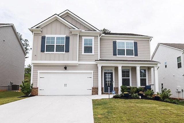 895 Garnet Dr, Acworth, GA 30101 - craftsman house featuring board and batten siding, driveway, a front lawn, and a garage