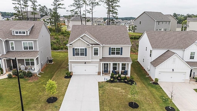 895 Garnet Dr, Acworth, GA 30101 - traditional-style home with board and batten siding, driveway, a residential view, and a porch