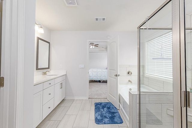 895 Garnet Dr, Acworth, GA 30101 - ensuite bathroom with vanity, a bath, a ceiling fan, tile patterned floors, and an enclosed shower